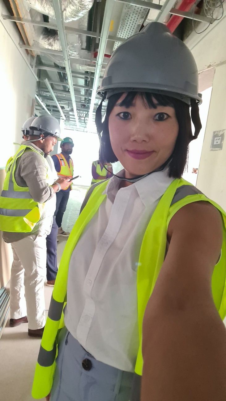 Ellen wearing a safety helmet on site
